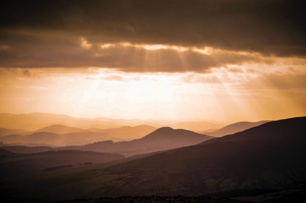 Sun shining through clouds